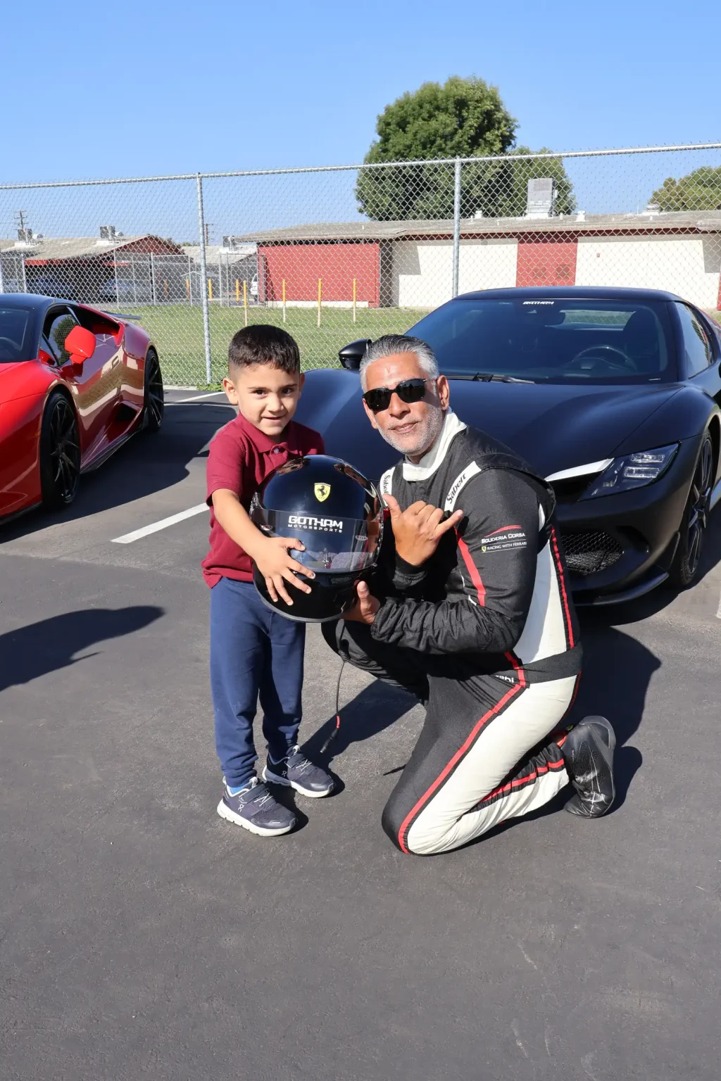 A young racing fan with a Gotham Motorsports driver