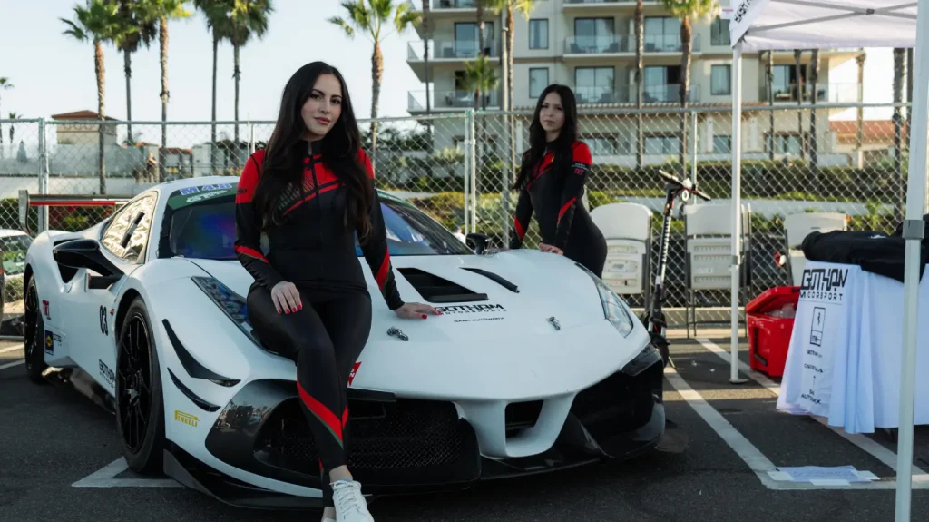 A Gotham Motorsports team member with the white Ferrari race car