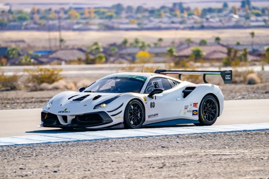 The white Gotham Motorsports Ferrari on track